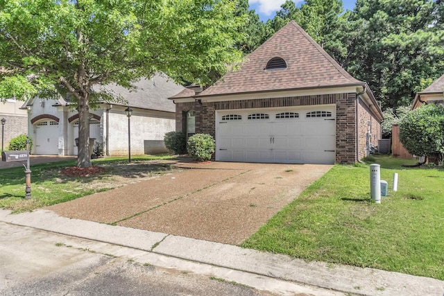 6836 Lagrange Grove Dr, Cordova, TN 38018 - view of front of home featuring concrete driveway, a front yard, a shingled roof, a garage, and brick siding