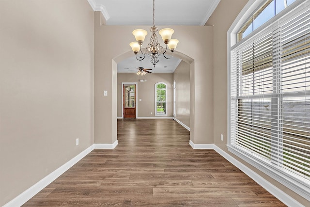 6836 Lagrange Grove Dr, Cordova, TN 38018 - unfurnished dining area with a chandelier, arched walkways, crown molding, and wood finished floors