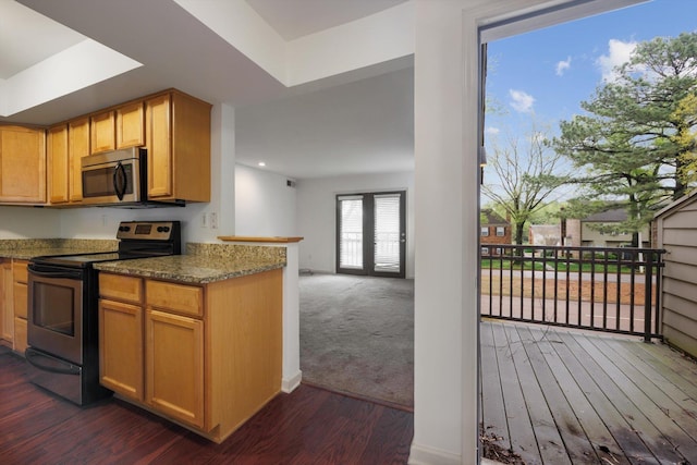 1824 Crossflower Cv Unit 94, Germantown, TN 38138 - kitchen with appliances with stainless steel finishes, dark wood-style flooring, recessed lighting, and dark stone counters