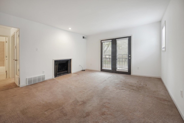 1824 Crossflower Cv Unit 94, Germantown, TN 38138 - unfurnished living room with a fireplace with flush hearth, light colored carpet, and recessed lighting