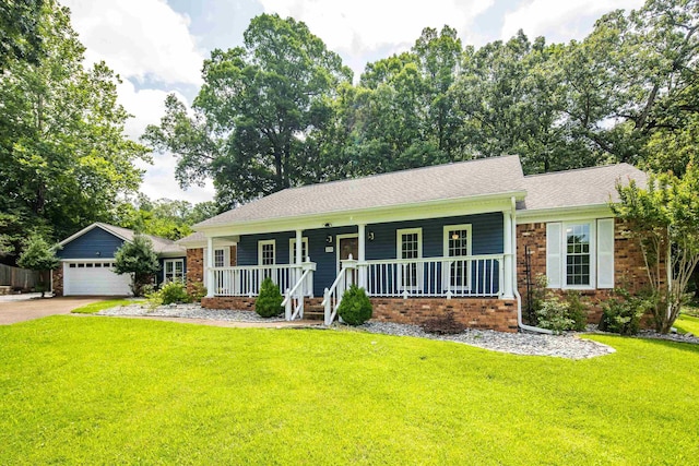2270 Atherstone Pl, Memphis, TN 38016 - single story home featuring a porch, a front lawn, driveway, and brick siding