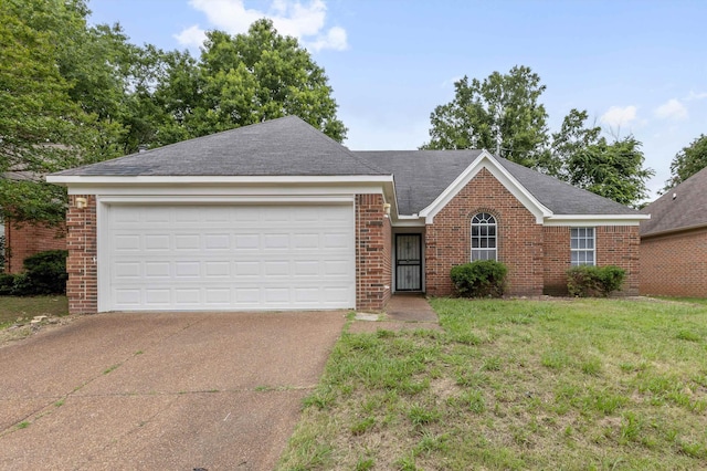 2766 Fletcher View Dr, Memphis, TN 38016 - ranch-style home with brick siding, concrete driveway, a garage, and a front lawn