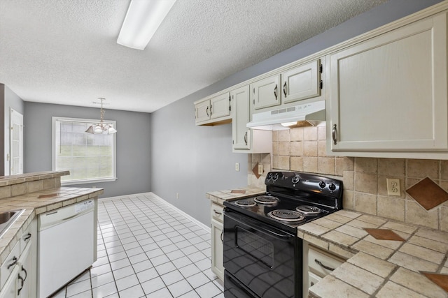 2766 Fletcher View Dr, Memphis, TN 38016 - kitchen with under cabinet range hood, dishwasher, black electric range oven, tile counters, and a textured ceiling