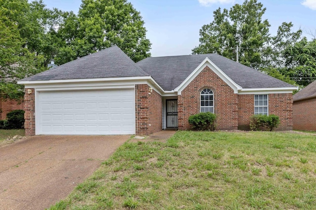 2766 Fletcher View Dr, Memphis, TN 38016 - ranch-style house featuring brick siding, driveway, an attached garage, a front yard, and a shingled roof