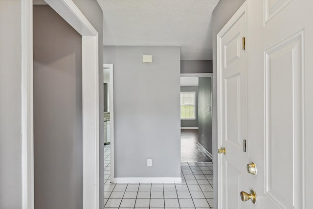 2766 Fletcher View Dr, Memphis, TN 38016 - hall featuring light tile patterned flooring and a textured ceiling