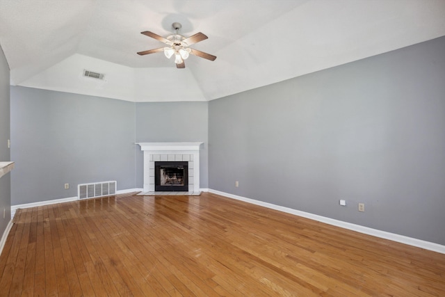 2766 Fletcher View Dr, Memphis, TN 38016 - unfurnished living room featuring a ceiling fan, a fireplace, light wood-style floors, and lofted ceiling