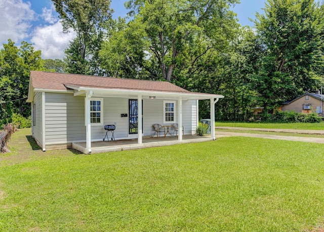 3536 Kendrick Rd, Memphis, TN 38108 - view of front of house featuring covered porch and a front lawn