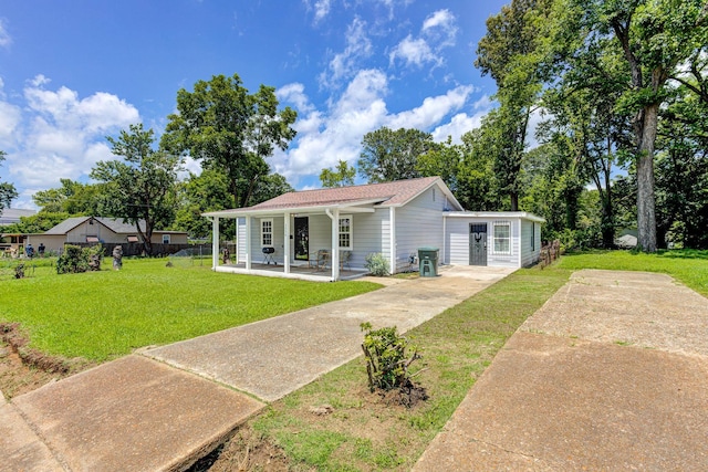 3536 Kendrick Rd, Memphis, TN 38108 - bungalow-style house with covered porch, a front lawn, driveway, and a shingled roof