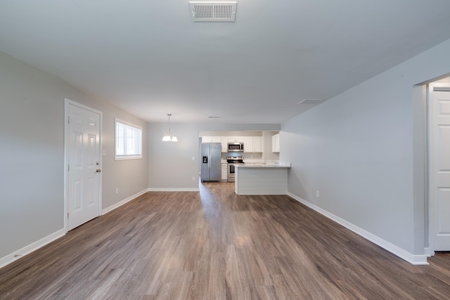 4825 Verne Rd, Memphis, TN 38117 - unfurnished living room with dark wood-type flooring