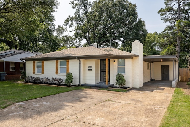 4825 Verne Rd, Memphis, TN 38117 - single story home featuring driveway, a chimney, brick siding, an attached carport, and a shingled roof