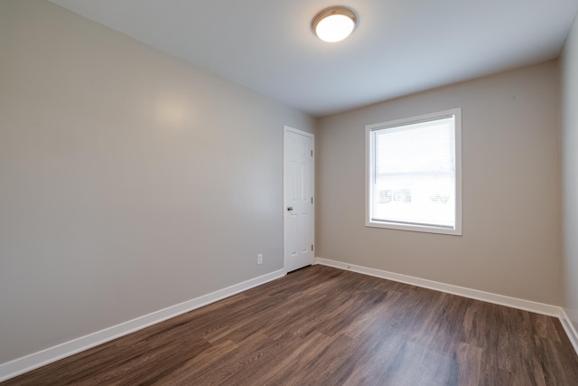 4825 Verne Rd, Memphis, TN 38117 - unfurnished room with baseboards and dark wood-type flooring