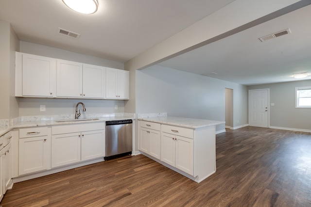 4825 Verne Rd, Memphis, TN 38117 - kitchen featuring dishwasher, a peninsula, dark wood-type flooring, and white cabinets