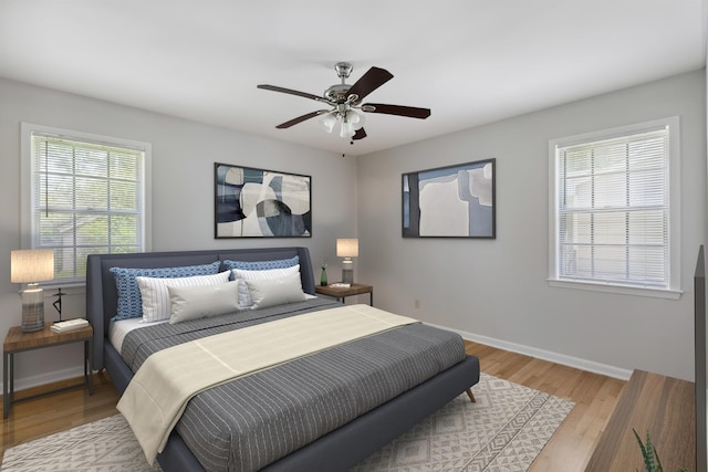 4338 Gardenview Dr, Memphis, TN 38116 - bedroom featuring multiple windows, light wood-style floors, and ceiling fan