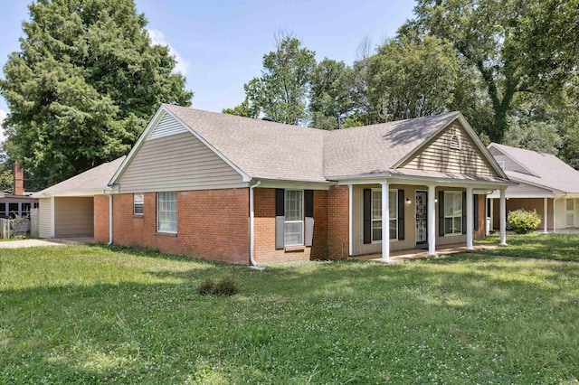 4338 Gardenview Dr, Memphis, TN 38116 - view of side of home with brick siding, a lawn, and a shingled roof
