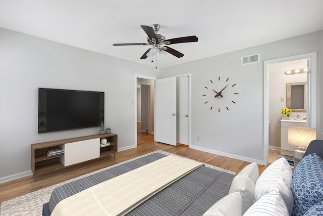 4338 Gardenview Dr, Memphis, TN 38116 - bedroom with wood finished floors, connected bathroom, and a ceiling fan