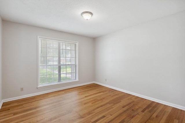 4338 Gardenview Dr, Memphis, TN 38116 - empty room featuring baseboards and light wood-style flooring