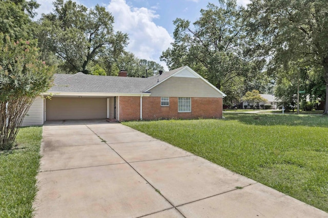 4338 Gardenview Dr, Memphis, TN 38116 - single story home with a garage, driveway, a front yard, a chimney, and brick siding