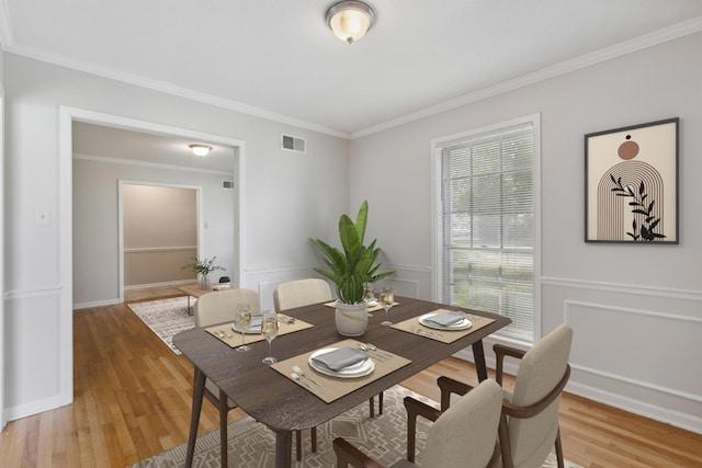 4338 Gardenview Dr, Memphis, TN 38116 - dining space featuring ornamental molding and light wood-style flooring