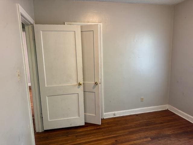 1827 S Orleans Ave, Memphis, TN 38106 - unfurnished bedroom with dark wood finished floors