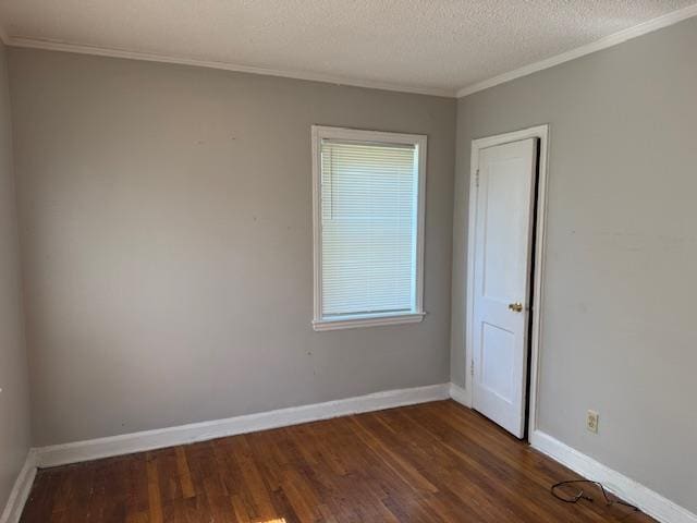 1827 S Orleans Ave, Memphis, TN 38106 - unfurnished room featuring ornamental molding, dark wood-style flooring, a textured ceiling, and plenty of natural light