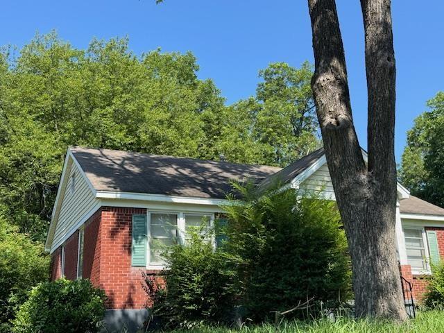 1827 S Orleans Ave, Memphis, TN 38106 - view of side of home featuring brick siding