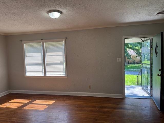 1827 S Orleans Ave, Memphis, TN 38106 - empty room with a textured ceiling, wood-type flooring, and crown molding