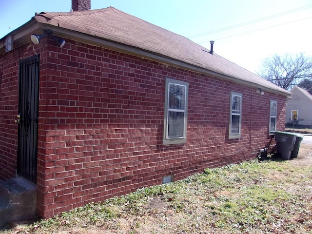 2606 Deadrick Ave, Memphis, TN 38114 - view of property exterior with brick siding and a chimney
