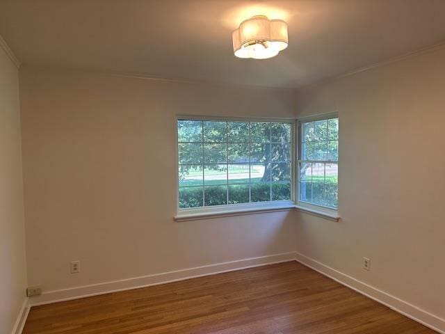 118 N Highland St N, Memphis, TN 38111 - empty room with wood finished floors and crown molding