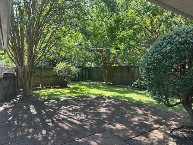 118 N Highland St N, Memphis, TN 38111 - fenced backyard with a patio