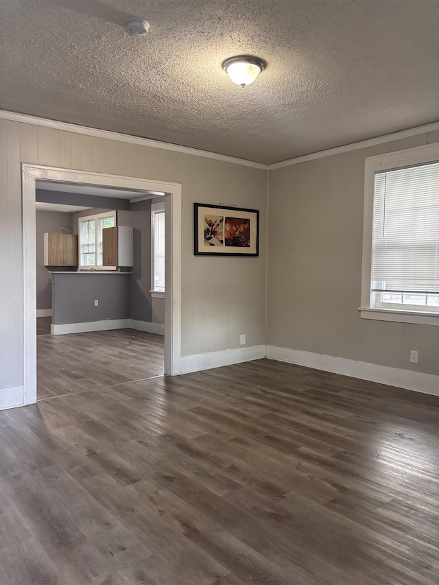 1043 Pearce St, Memphis, TN 38107 - spare room with a textured ceiling, ornamental molding, wood finished floors, and a smoke detector