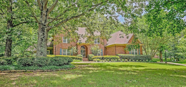 4030 Windolyn Way, Bartlett, TN 38133 - tudor house with brick siding and a front lawn