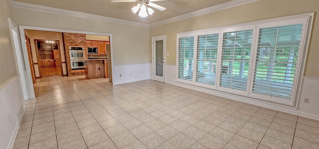 4030 Windolyn Way, Bartlett, TN 38133 - unfurnished room featuring ceiling fan, plenty of natural light, ornamental molding, light tile patterned flooring, and a wainscoted wall