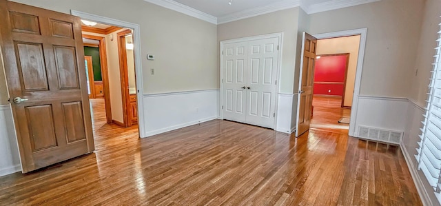 4030 Windolyn Way, Bartlett, TN 38133 - unfurnished bedroom with wood finished floors, crown molding, and a closet