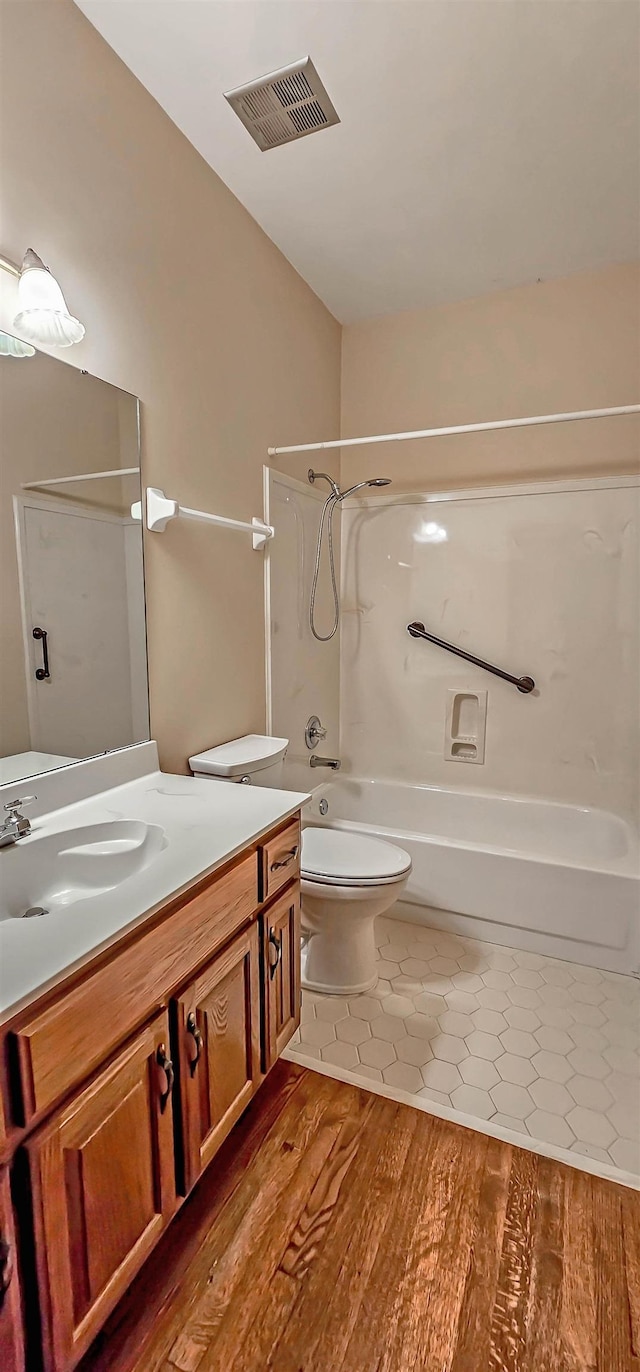 4030 Windolyn Way, Bartlett, TN 38133 - bathroom featuring shower / bath combination, vanity, and wood finished floors