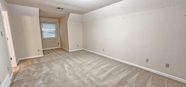 4030 Windolyn Way, Bartlett, TN 38133 - spare room featuring light colored carpet, a textured ceiling, and lofted ceiling