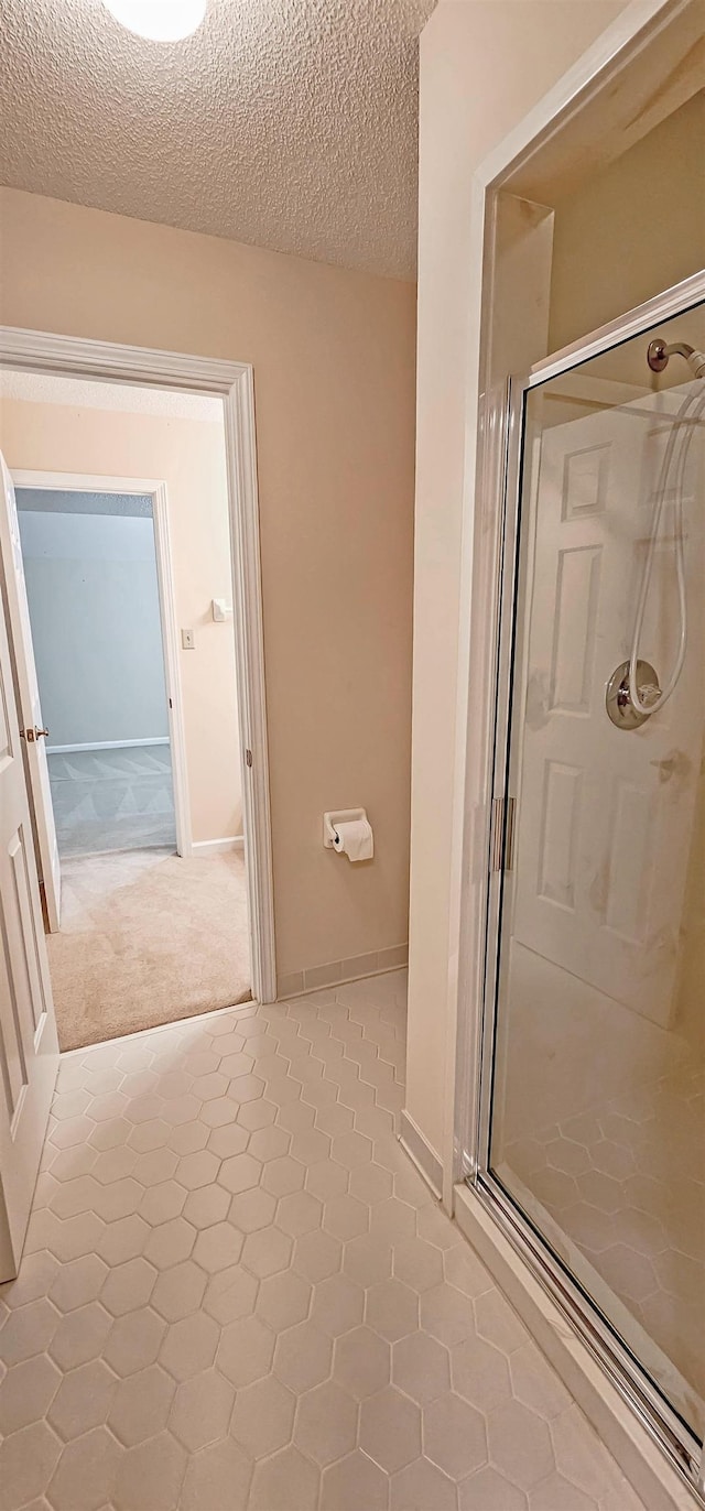 4030 Windolyn Way, Bartlett, TN 38133 - full bath featuring a shower stall, a textured ceiling, and tile patterned floors