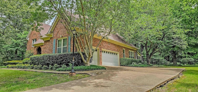 4030 Windolyn Way, Bartlett, TN 38133 - view of home's exterior featuring brick siding, concrete driveway, a lawn, and an attached garage