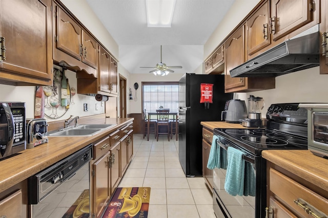 4532 Quail Flight Cv, Memphis, TN 38141 - kitchen featuring black range with electric stovetop, dishwashing machine, under cabinet range hood, butcher block counters, and ceiling fan