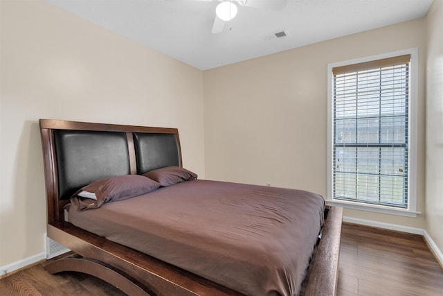 4532 Quail Flight Cv, Memphis, TN 38141 - bedroom with multiple windows, wood finished floors, and a ceiling fan