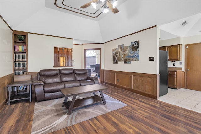 4532 Quail Flight Cv, Memphis, TN 38141 - living area with a ceiling fan, light wood-style floors, lofted ceiling, and wainscoting