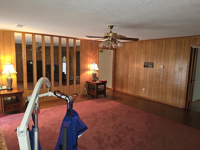8355 Craven Rd, Bartlett, TN 38002 - carpeted bedroom with wood walls and a textured ceiling