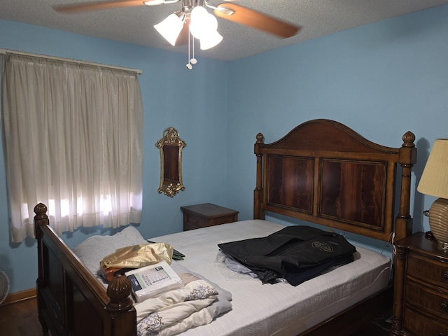 8355 Craven Rd, Bartlett, TN 38002 - bedroom featuring a ceiling fan and wood finished floors
