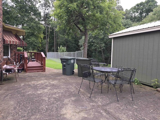 8355 Craven Rd, Bartlett, TN 38002 - view of patio featuring a wooden deck, outdoor dining area, and view of scattered trees