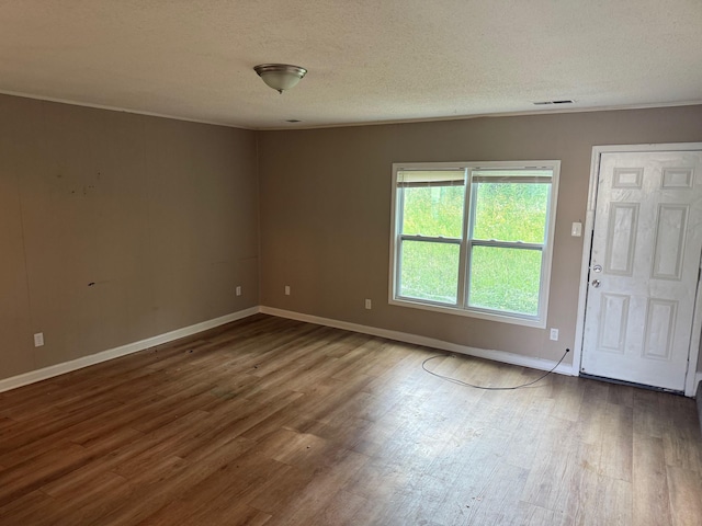 3816 Cedar Path Dr, Memphis, TN 38115 - spare room with wood finished floors and a textured ceiling