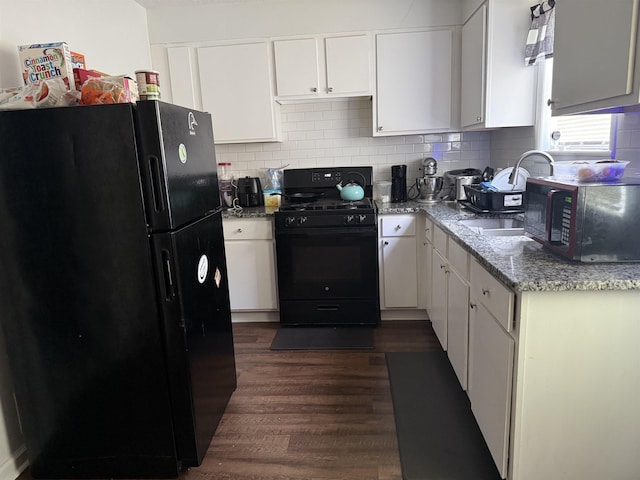 1759 Walter St, Memphis, TN 38108 - kitchen featuring black appliances, white cabinetry, dark wood-style flooring, and backsplash