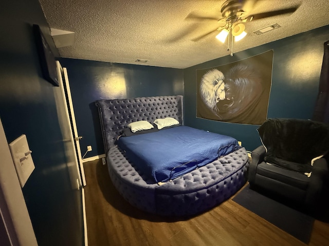 1759 Walter St, Memphis, TN 38108 - bedroom featuring wood finished floors, a textured ceiling, and ceiling fan