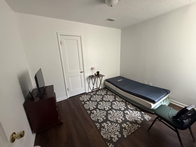 1759 Walter St, Memphis, TN 38108 - exercise area featuring wood finished floors and a textured ceiling