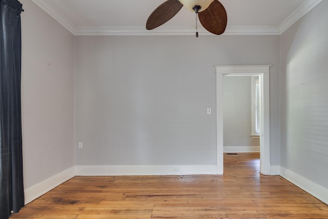 699 New York St, Memphis, TN 38104 - spare room with ornamental molding, ceiling fan, and light wood finished floors