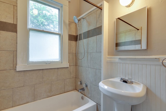 699 New York St, Memphis, TN 38104 - full bathroom featuring washtub / shower combination and a wainscoted wall