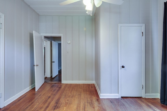699 New York St, Memphis, TN 38104 - spare room with hardwood / wood-style flooring, ceiling fan, and a decorative wall